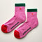 pink crew socks with green trim and red embroidered heart