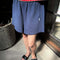 model wearing midnight blue relaxed fit basketball shorts
