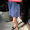 side view of model wearing midnight blue relaxed fit basketball shorts