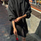 model wearing black french terry swing dress