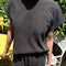 model wearing dark slate relaxed fit cotton tee with muscle type sleeves and side vents