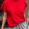 model wearing red relaxed fit tee