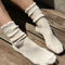 model wearing white ribbed scalloped socks