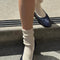 model wearing white ribbed scalloped socks