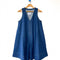 blue denim mini dress on a wooden hanger