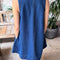 back view of model wearing blue denim mini dress