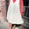 model wearing white denim mini dress with red and white stripe top