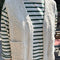 model wearing natural chunky knit open front vest with patch pockets