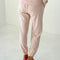 back view of model wearing light pink pointelle jogger pants