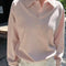 model wearing baby pink relaxed fit polo sweatshirt