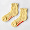 model wearing light yellow ruffle socks