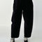 model wearing black corduroy arc pants
