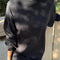 model wearing black cotton long sleeve tunic with mockneck