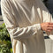 model wearing naturel long sleeve tee with deep side vents