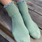 model wearing sea foam socks with baby blue trim