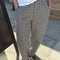 model wearing black and white gingham relaxed fit pants