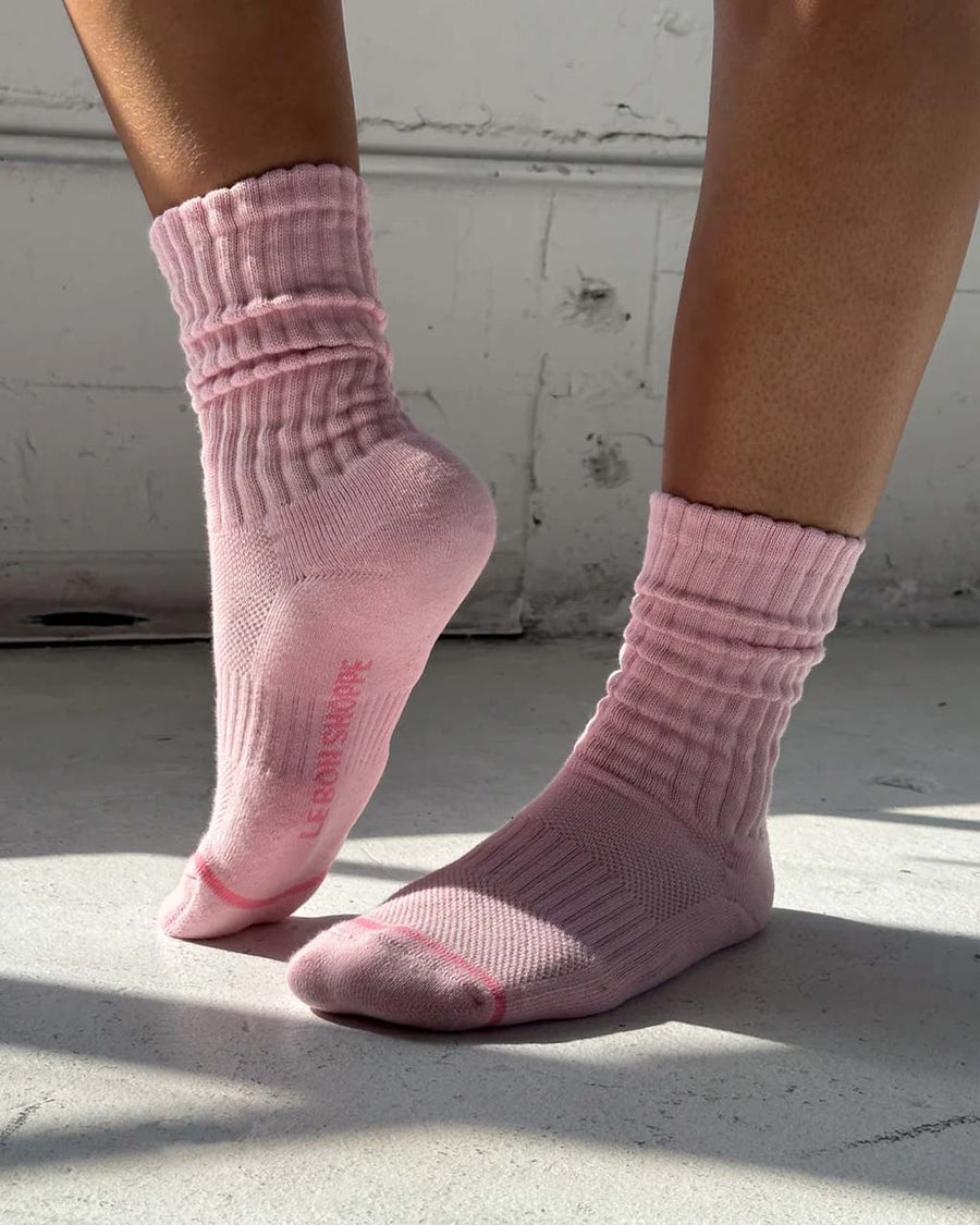 side view of model wearing ballet pink socks with high cuff