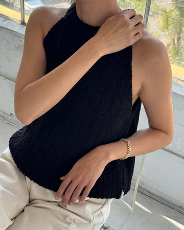 model wearing black knit halter sweater top 