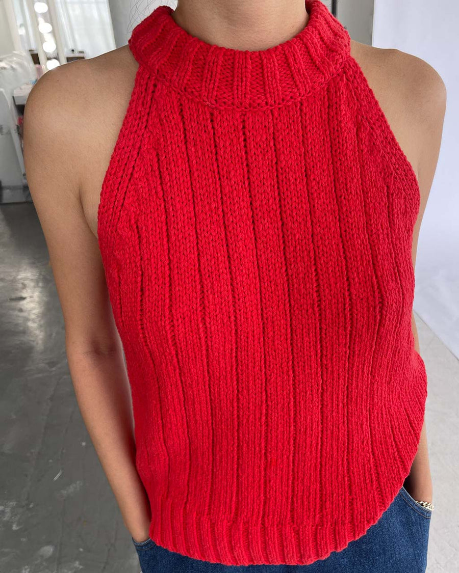 up close of model wearing red knit halter sweater top 