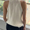 back view of model wearing naturel knit halter sweater top 