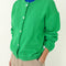 model wearing buttoned spring green cotton cardigan