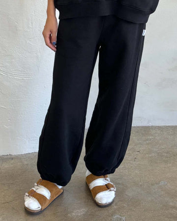 model wearing black french terry balloon cotton pants
