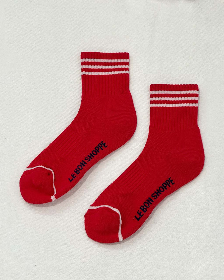 red socks with two white strips on top