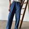 model wearing blue denim extended length arc pants