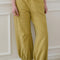 model wearing ochre yellow cotton balloon pants and grey tee