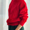 side view of model wearing red mohair pull over sweater