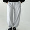 model wearing icy grey french terry balloon pants with side pockets and side panels