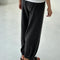 back view of model wearing charcoal pointelle cotton balloon pants