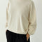 model wearing cream pointelle long sleeve sweatshirt with banded wrists and waist