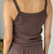 back view of model wearing chocolate tank with all over pointelle print