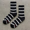black high crew socks with white thin stripes
