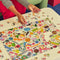 le puzz 500 piece puzzle with colorful erasers on a table