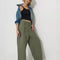 model wearing olive green slouch chino pants with pleated front