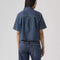 back view of model wearing western dark denim short sleeve button down top