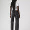back view of model wearing washed black relaxed fit straight leg jeans