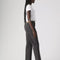 sideview of model wearing washed black relaxed fit straight leg jeans