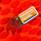 red 'sweetish' fish shaped dangle earrings on gold hoops and tin holder