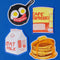 set of 4 brunch stickers: frying pan with egg and bacon smiley, cafe espresso can, stack of pancakes, and a carton of oat milk