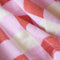 up close of coral, pink and white checked towel