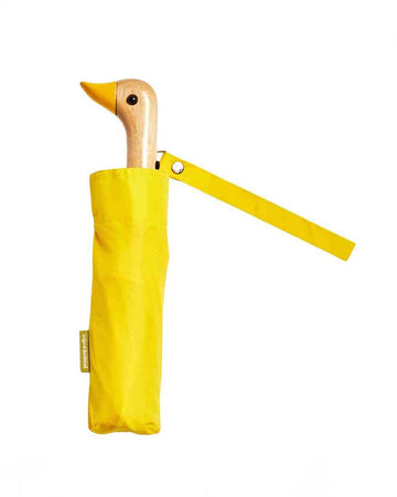 bright yellow compact umbrella with wooden duck head handle