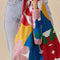 model holding white compact umbrella with wooden duck head handle and colorful abstract shape print and matching reusable bag