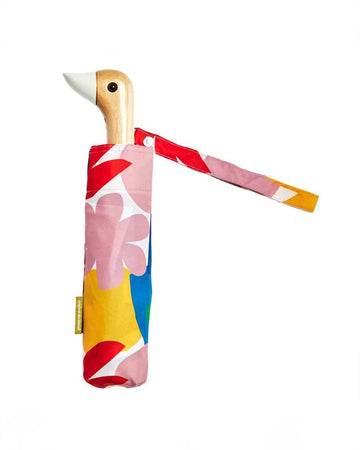 white compact umbrella with wooden duck head handle and colorful abstract shape print