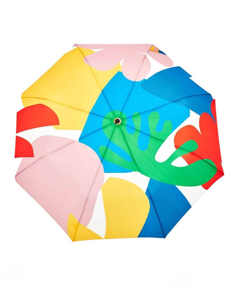 top view of white compact umbrella with wooden duck head handle and colorful abstract shape print