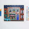painted paint by numbers kit with holiday store front and brushes 
