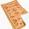 flattened yellow tea towel with colorful folk floral print