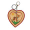 heart shaped keychain with deer design in a field design